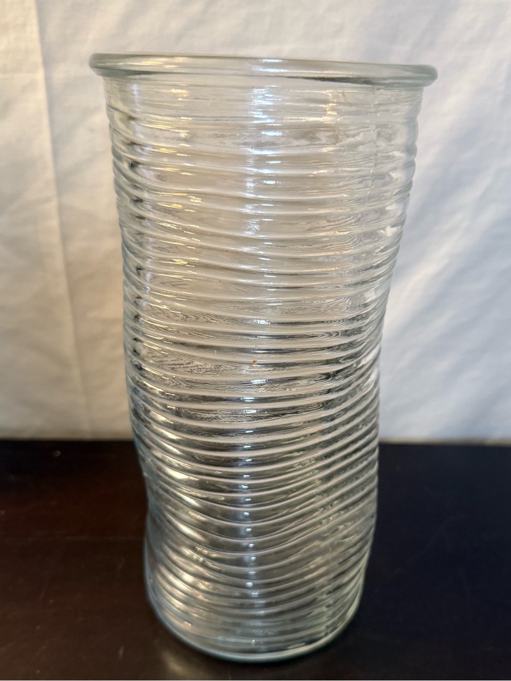 Ribbed glass vase, wavy, pinched shape. Mid-Century Modern design. 9.75”
